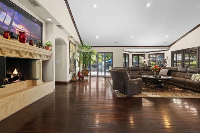 a kitchen with stainless steel appliances granite countertop a stove a sink and a wooden cabinets