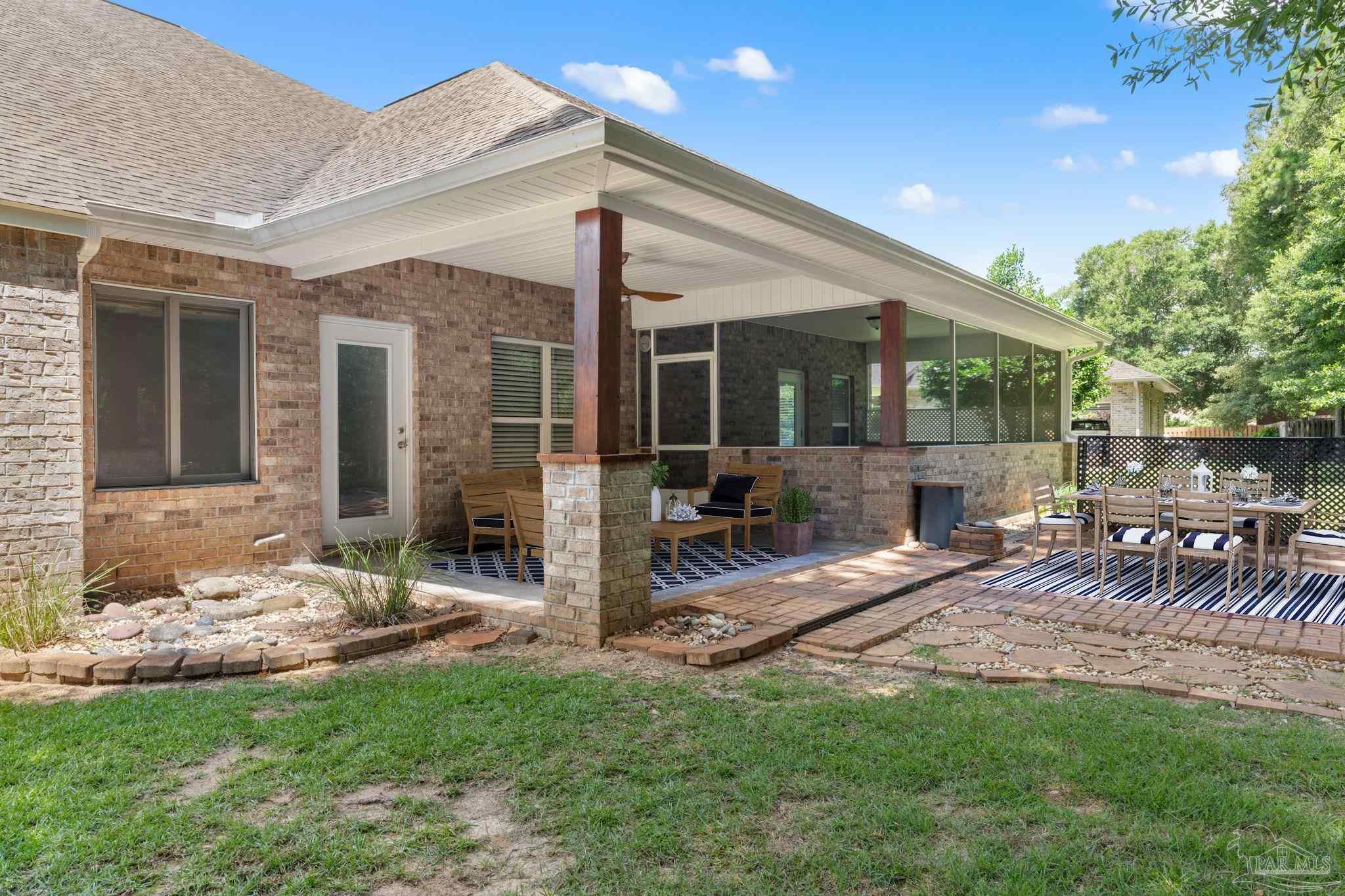 8664 Foxtail Loop Pensacola, FL 32526 - Photo 12 of 46 a view of a house with backyard and sitting area