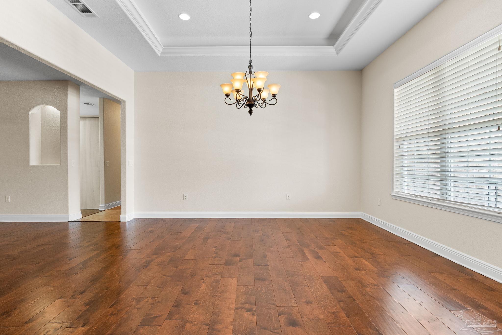 8664 Foxtail Loop Pensacola, FL 32526 - Photo 16 of 46 a view of a room with wooden floor