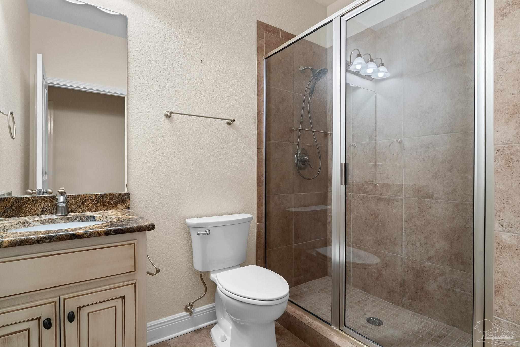 8664 Foxtail Loop Pensacola, FL 32526 - Photo 33 of 46 a bathroom with a shower toilet and a sink