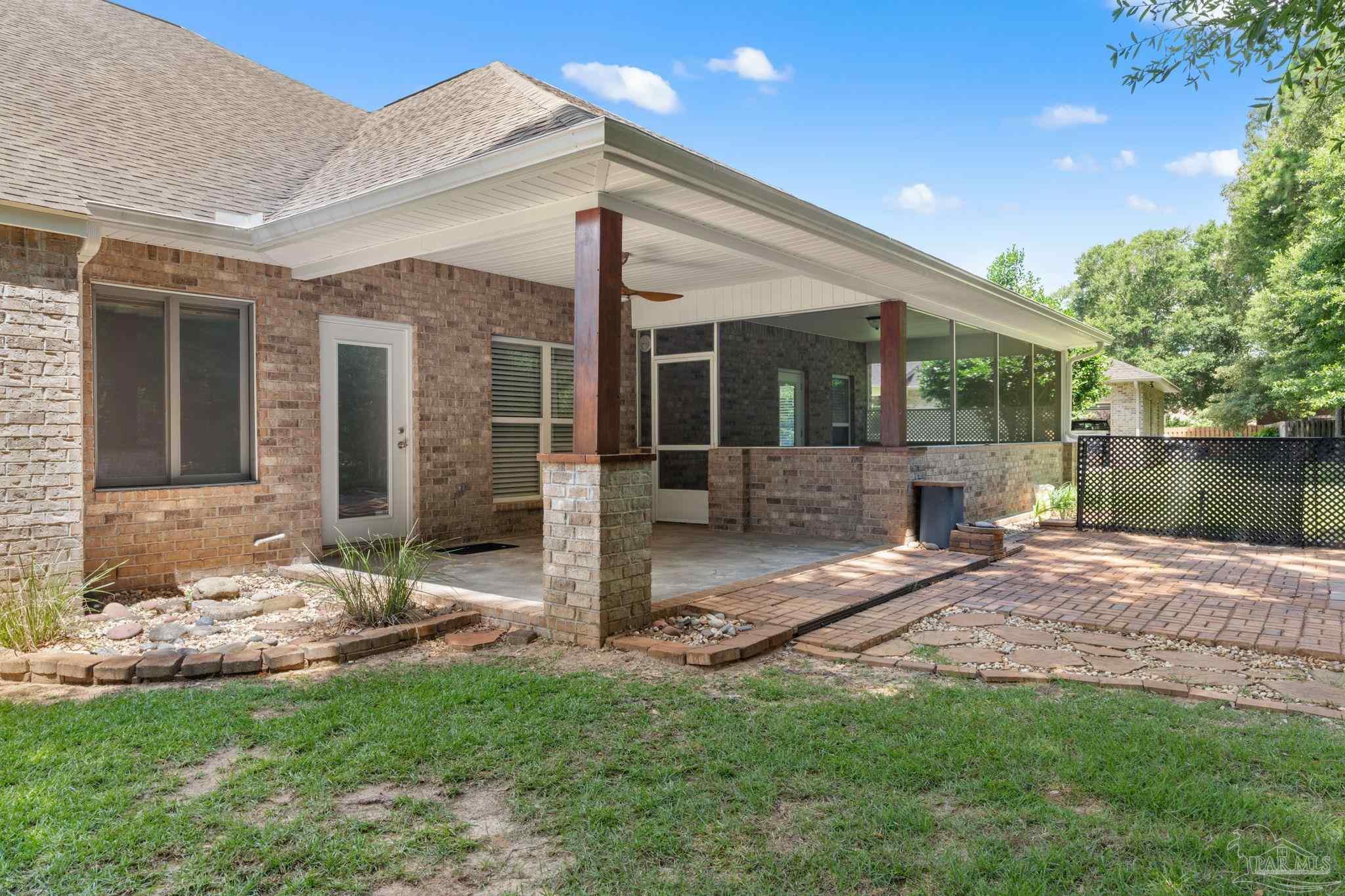 8664 Foxtail Loop Pensacola, FL 32526 - Photo 38 of 46 a view of a house with backyard and porch