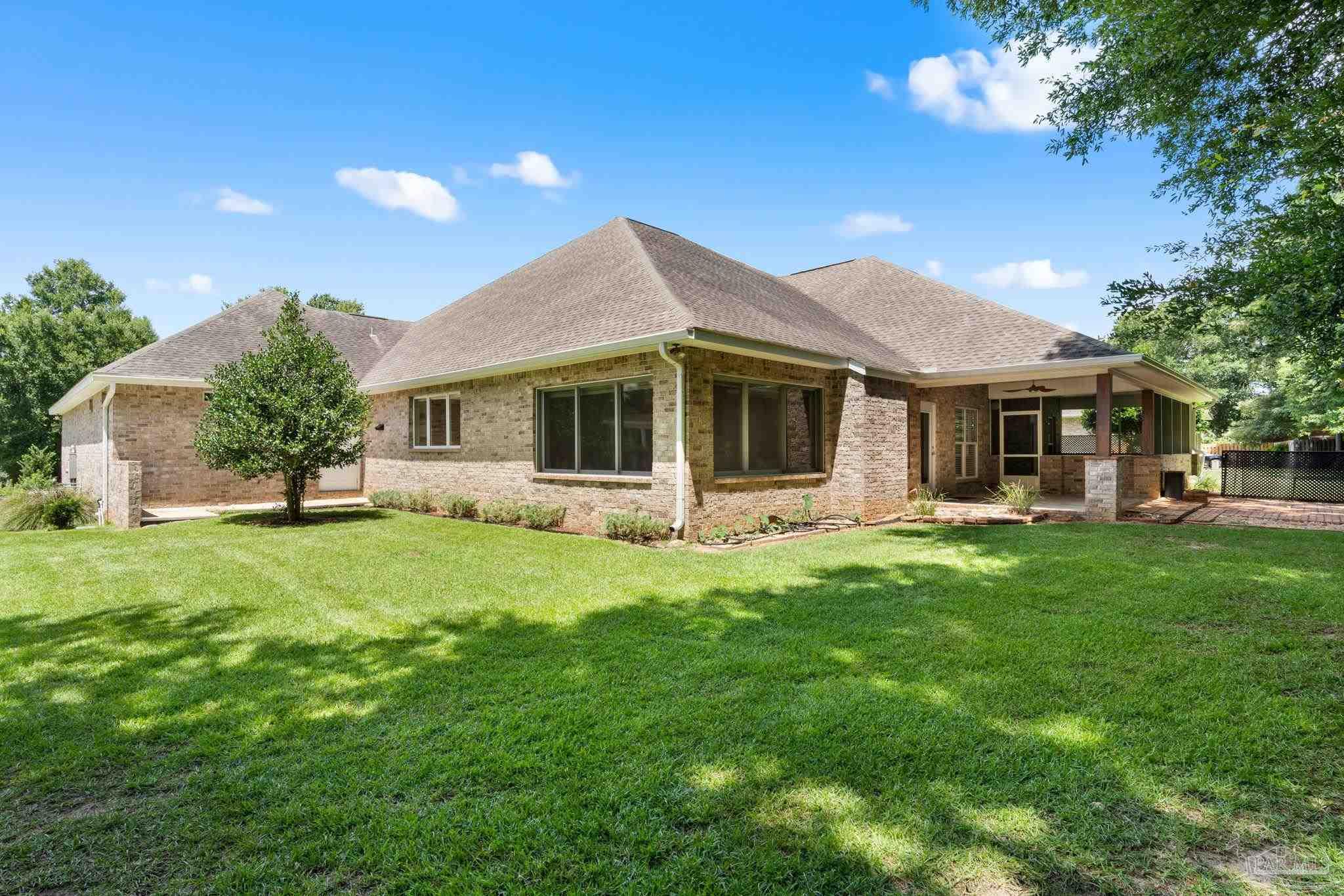 8664 Foxtail Loop Pensacola, FL 32526 - Photo 39 of 46 a front view of a house with a garden