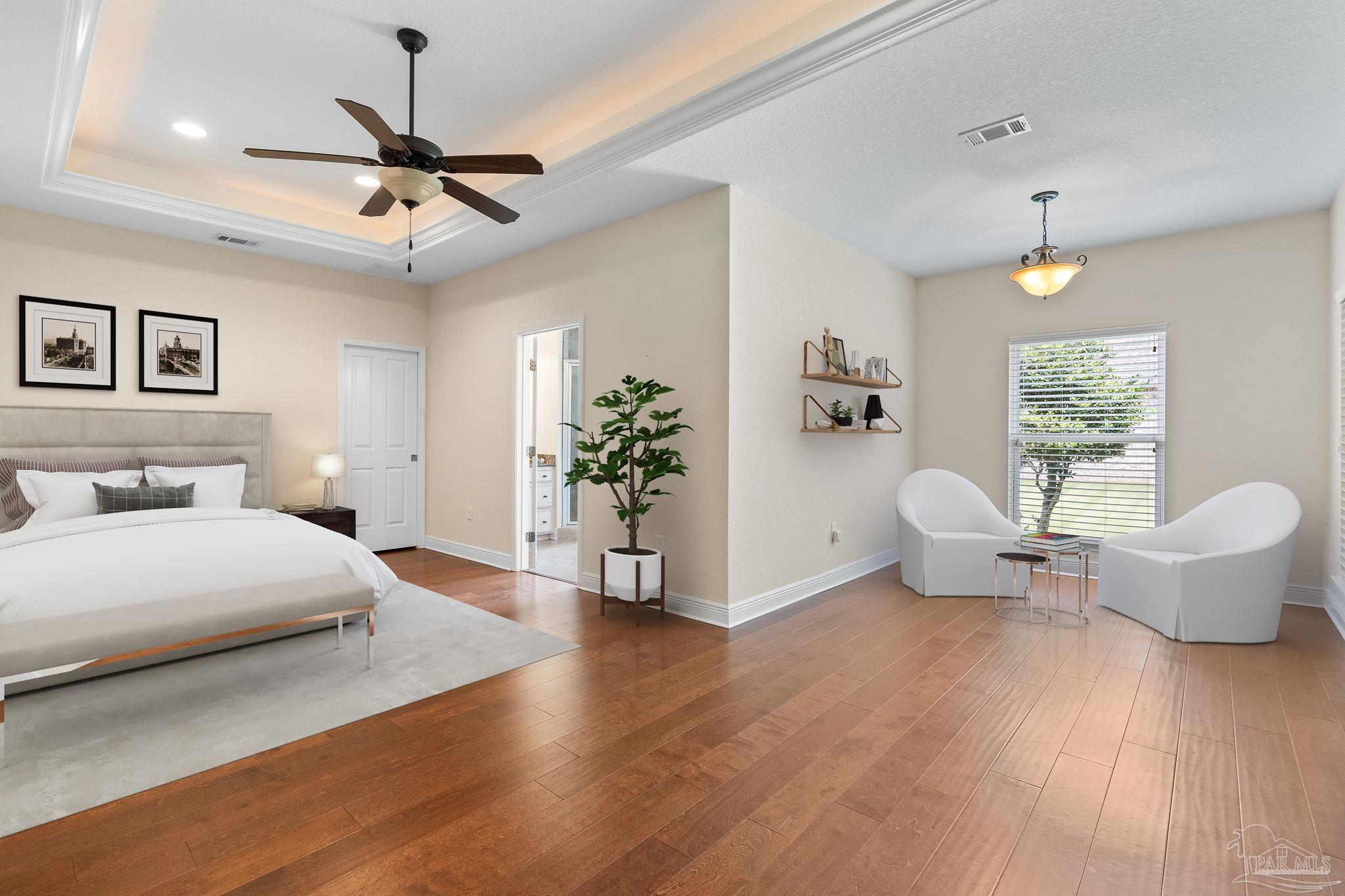 8664 Foxtail Loop Pensacola, FL 32526 - Photo 4 of 46 a spacious bedroom with a large bed and a chandelier