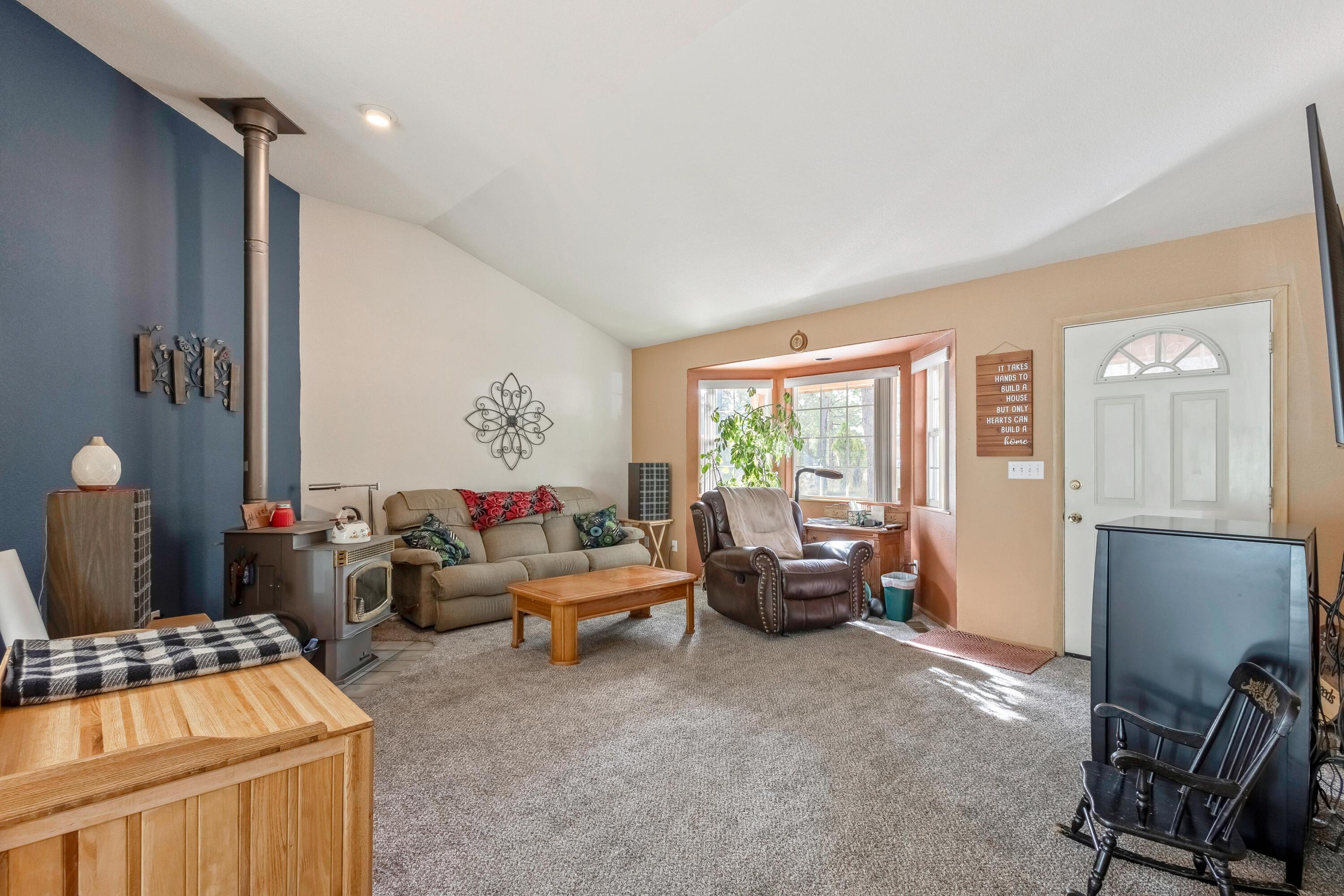 18900 Tuscarora Lane Bend, OR 97702 - Photo 4 of 20 a living room with furniture and a window