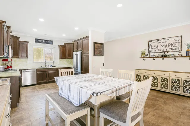 a kitchen with stainless steel appliances a stove a sink a microwave a counter top space and cabinets