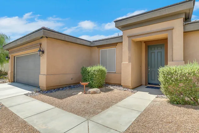 a dining room with furniture a table and chairs