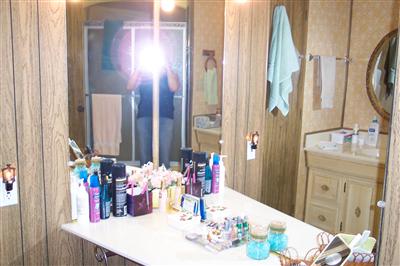399 Ricardo Avenue, Unit 399 Santa Rosa, CA 95407 - Photo 11 of 11 a bathroom with a mirror sink and a mirror