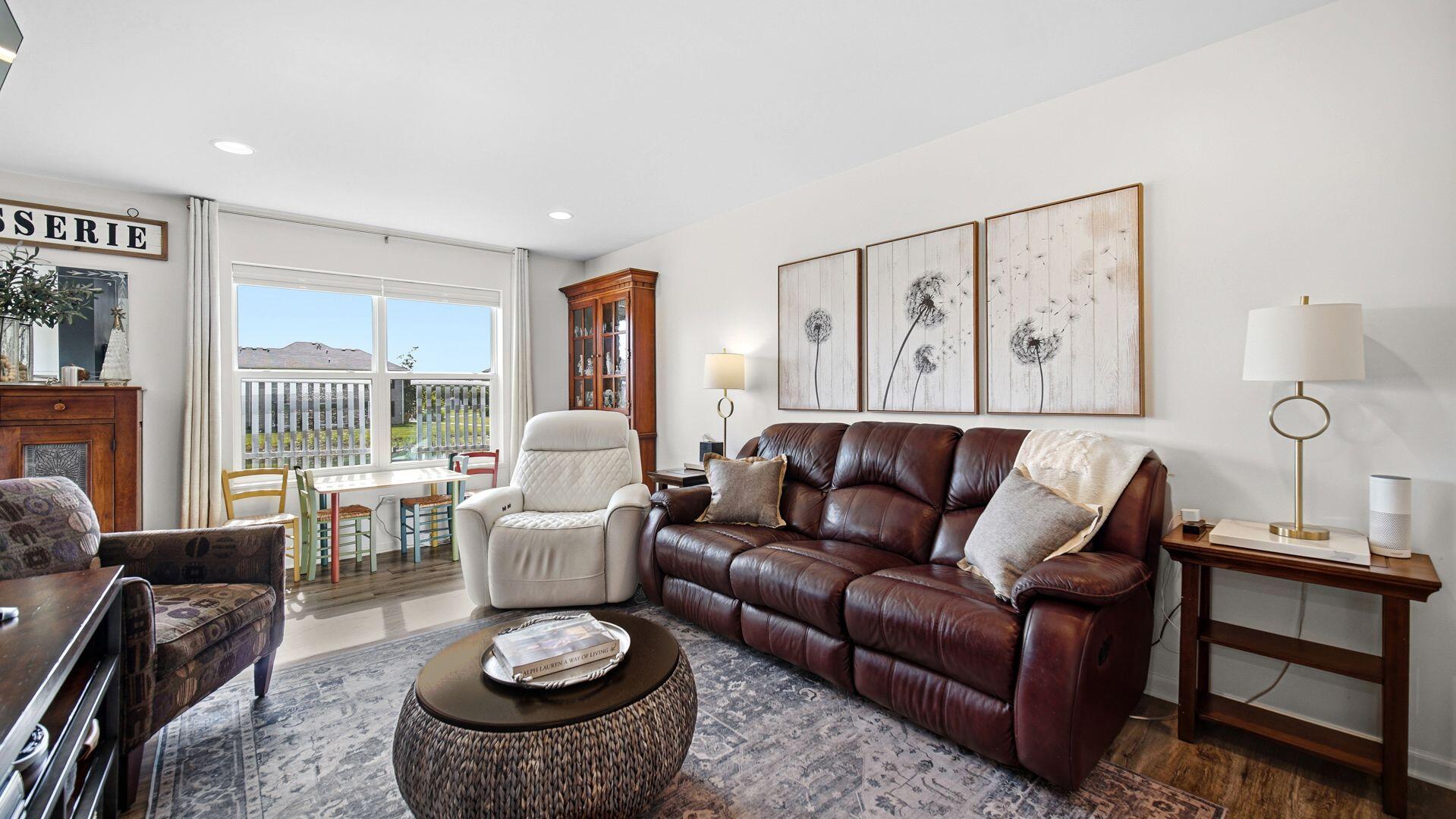 11175 Vermont Circle Crown Point, IN 46307 - Photo 5 of 22 a living room with furniture and a large window