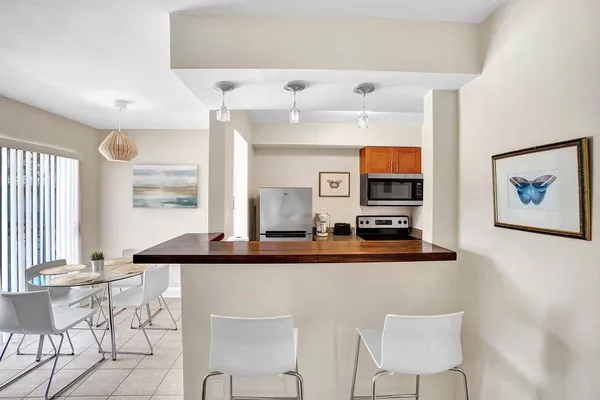 a bathroom with a sink vanity mirror and toilet