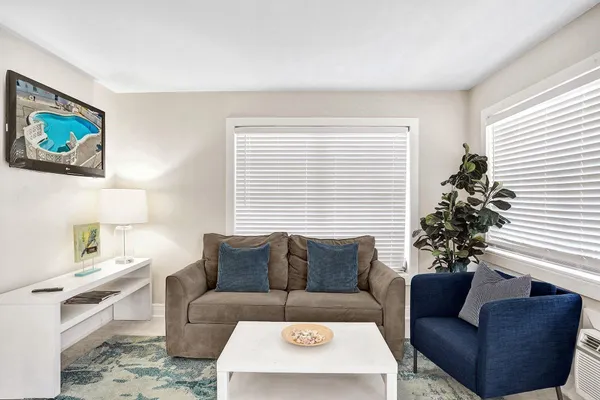 a living room with furniture and a table