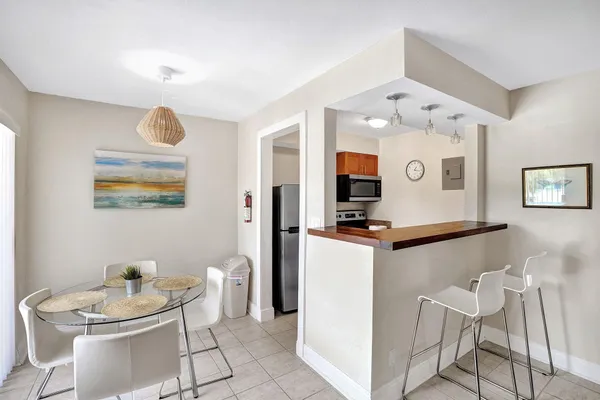 a view of a dining room with furniture and a window