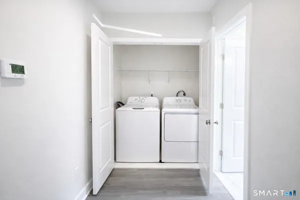 a utility room with dryer and washer