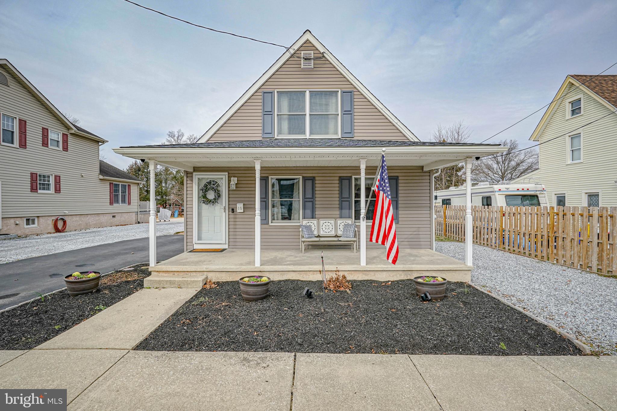 a view of a house with wooden floor and a yard