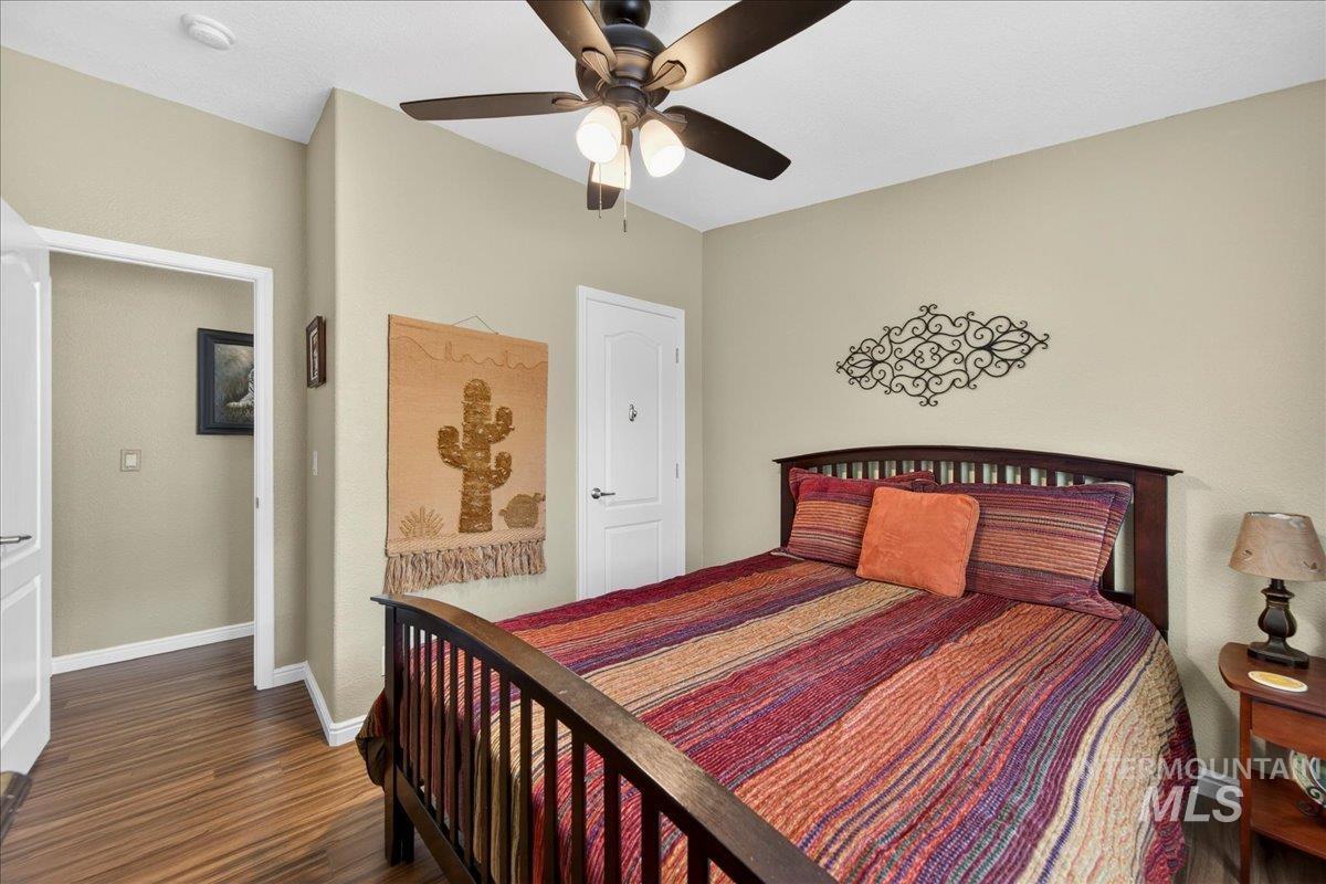 421 South Curtis Road, Unit 118 Boise, ID 83705 - Photo 27 of 49 Bedroom with dark wood finished floors and ceiling fan