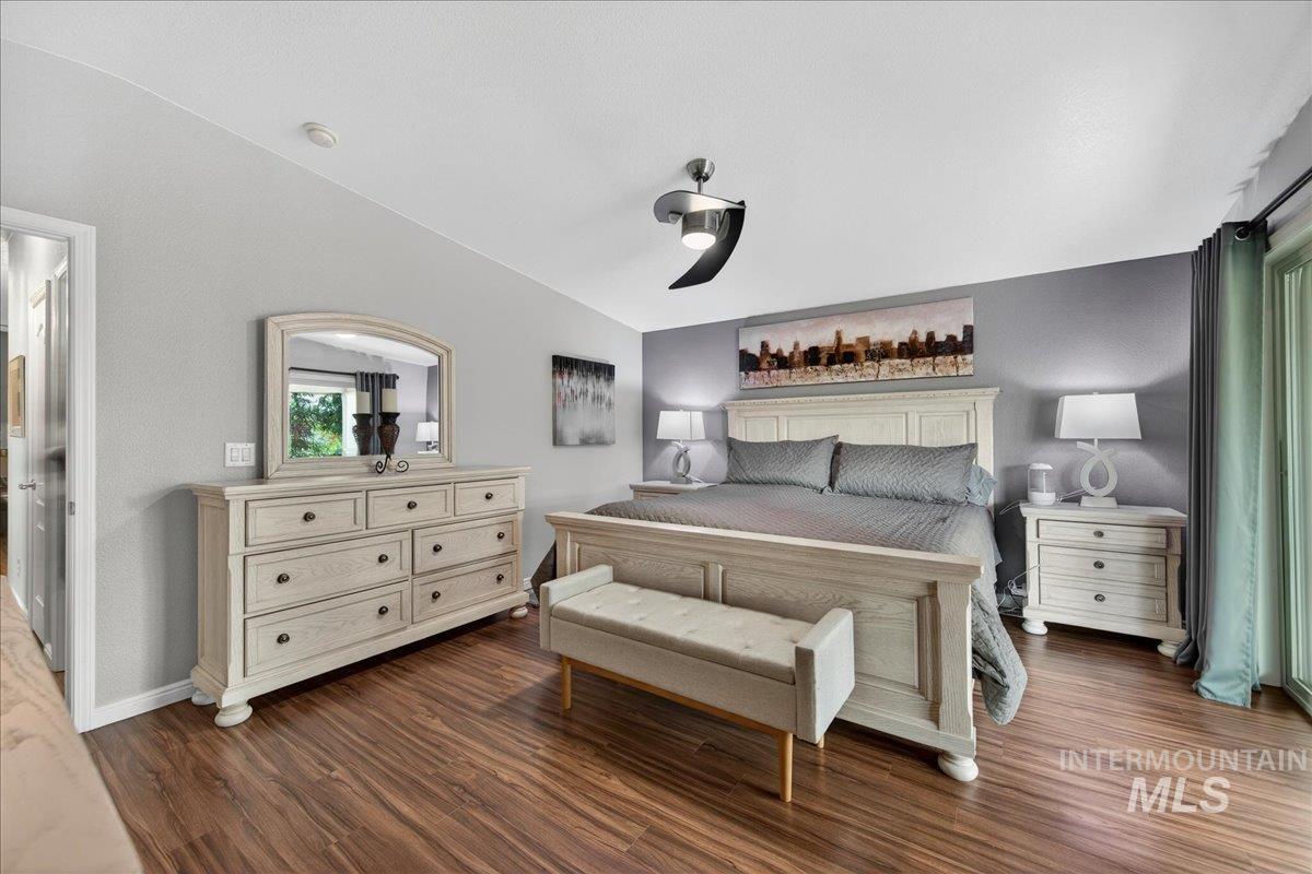421 South Curtis Road, Unit 118 Boise, ID 83705 - Photo 29 of 49 Bedroom with dark wood-style floors and ceiling fan