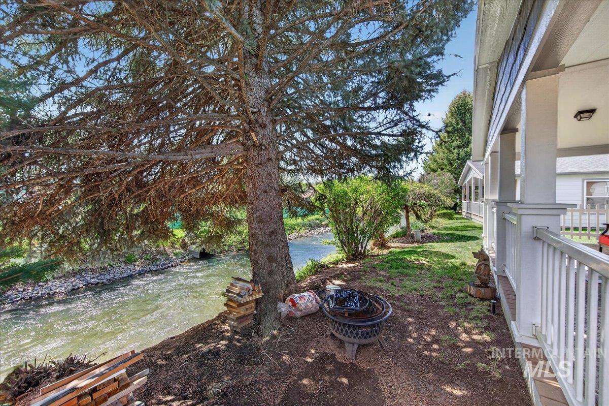 421 South Curtis Road, Unit 118 Boise, ID 83705 - Photo 45 of 49 View of yard with a water view and an outdoor fire pit
