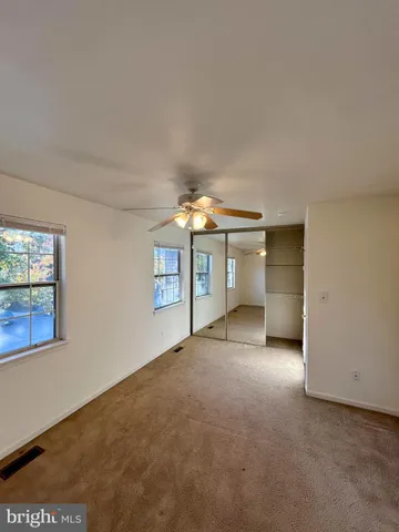 a view of empty room with windows