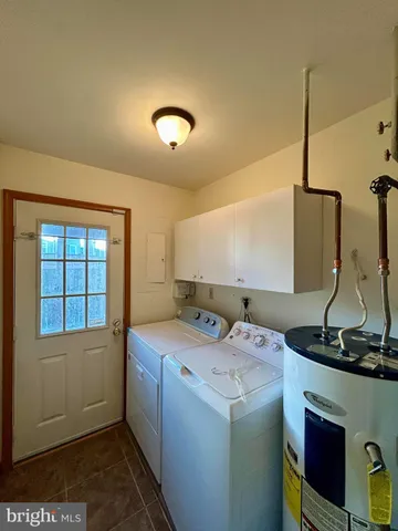 a view of a balcony with wooden floor and floor to ceiling window