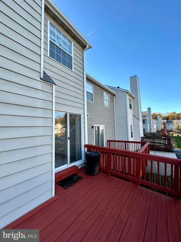a view of a house with wooden fence