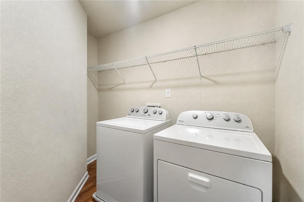 10933 Wheeler Trace Hampton, GA 30228 - Photo 11 of 22 a utility room with dryer and washer
