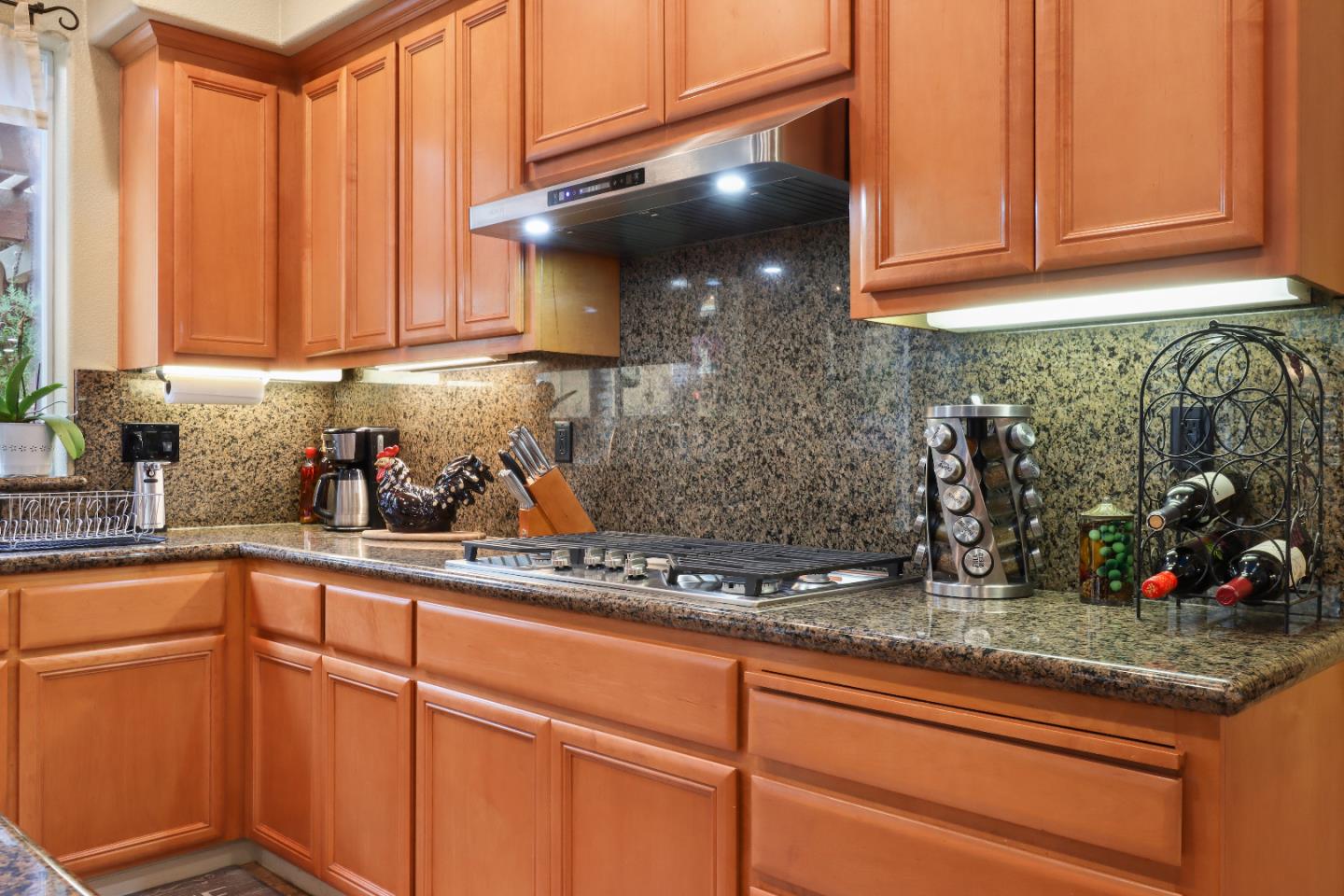 1960 County Down Way Gilroy, CA 95020 - Photo 15 of 62 a kitchen with stainless steel appliances granite countertop a sink a stove and cabinets