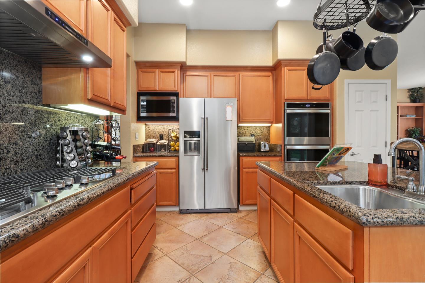 1960 County Down Way Gilroy, CA 95020 - Photo 16 of 62 a kitchen with stainless steel appliances granite countertop a sink and a stove