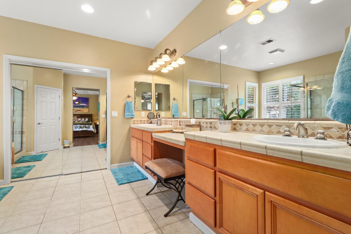 1960 County Down Way Gilroy, CA 95020 - Photo 21 of 62 a large bathroom with a large mirror vanity and sink