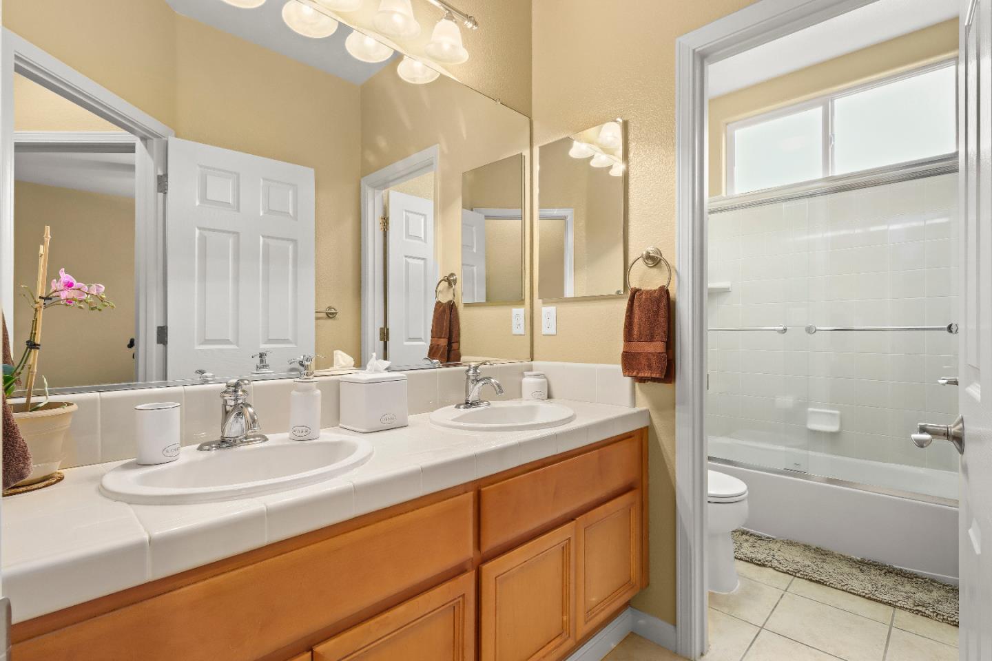 1960 County Down Way Gilroy, CA 95020 - Photo 26 of 62 a bathroom with a granite countertop sink mirror and a bathtub
