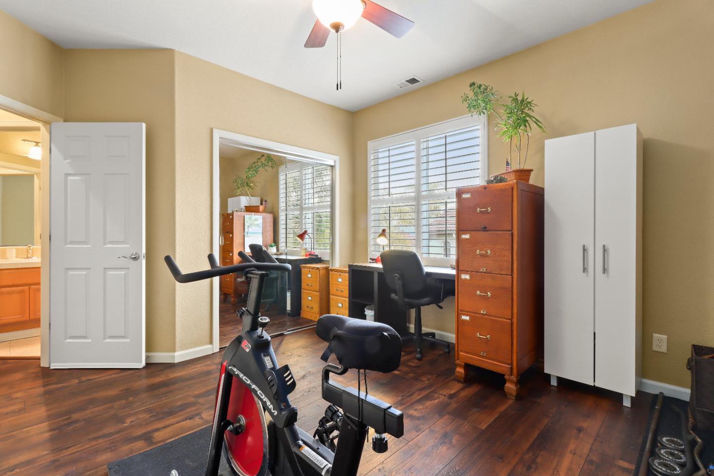1960 County Down Way Gilroy, CA 95020 - Photo 28 of 62 a view of a workspace with furniture and wooden floor