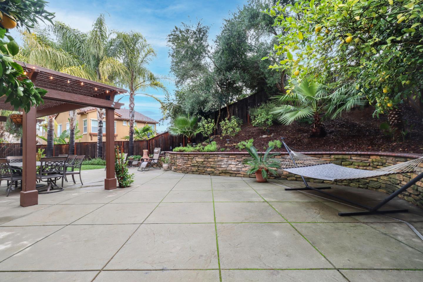 1960 County Down Way Gilroy, CA 95020 - Photo 47 of 62 a view of a patio with a table and chairs and potted plants