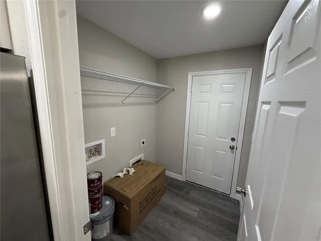 a room with a closet and wooden floor