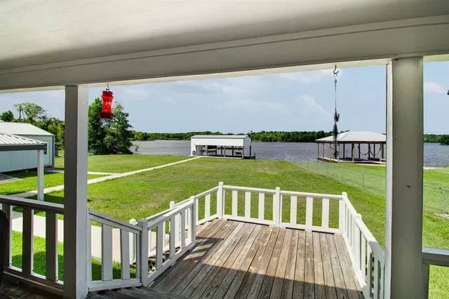 a view of a chairs and table on the deck