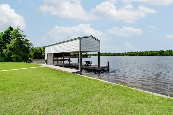 a view of a lake with a table and a chair