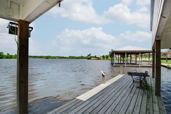 an aerial view of a house with a lake view