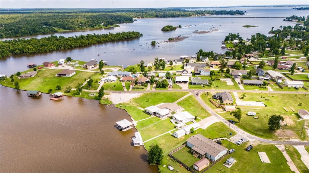122 Read Oak Onalaska, TX 77360 - Photo 25 of 34 an aerial view of a house with a lake view