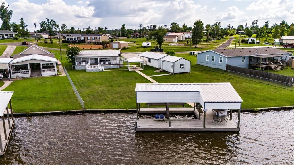 122 Read Oak Onalaska, TX 77360 - Photo 28 of 34 a aerial view of a house with a garden and lake view