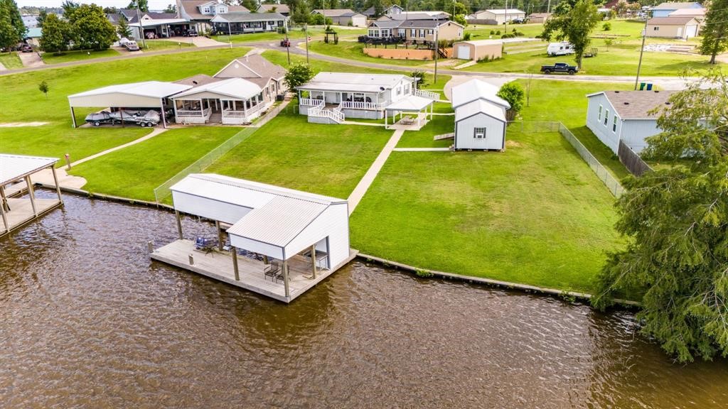 122 Read Oak Onalaska, TX 77360 - Photo 29 of 34 swimming pool table and chairs in the garden