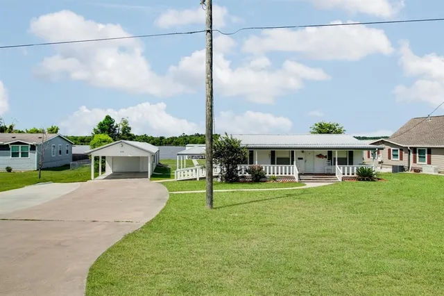 a front view of a house with a yard