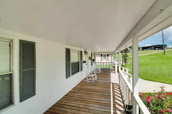 a view of a porch with furniture