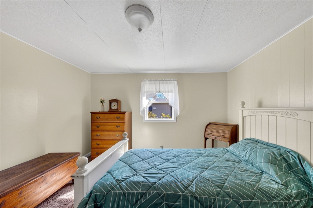 19 Timber Lane Wareham, MA 02571 - Photo 20 of 38 a bedroom with a bed and a closet