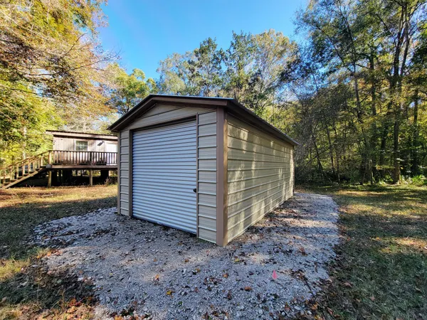 a view of a roof deck with couches and wooden floor