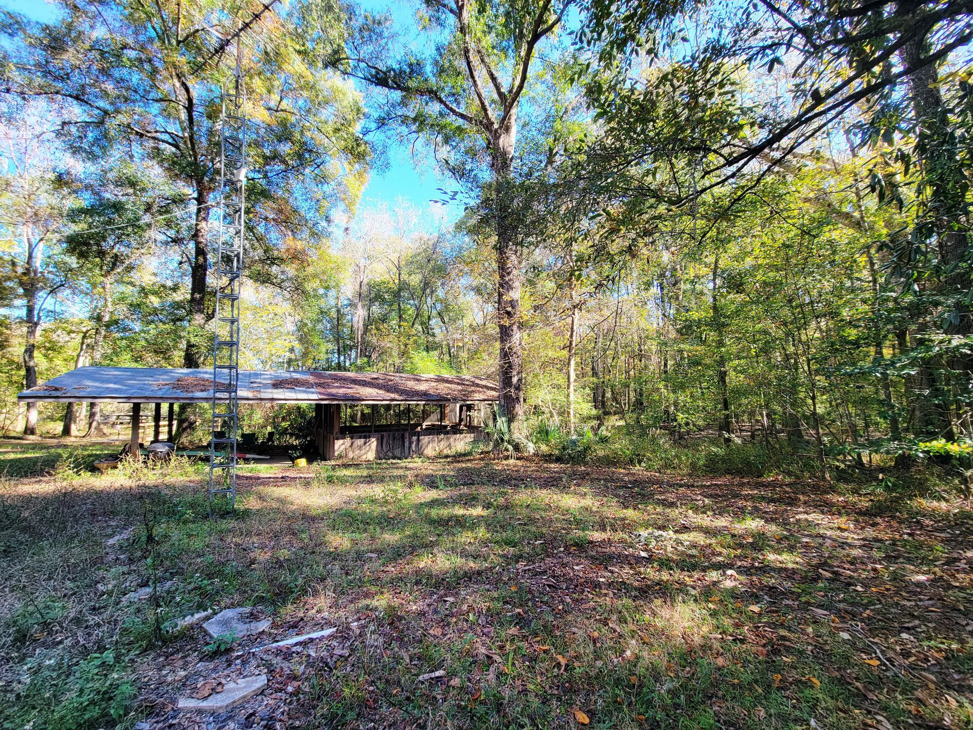 1907 River Road Ponce de Leon, FL 32455 - Photo 30 of 63 a view of a house with backyard porch and sitting area