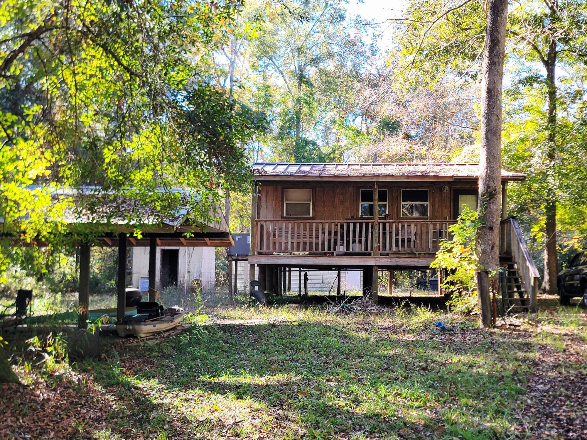 1907 River Road Ponce de Leon, FL 32455 - Photo 35 of 63 a front view of a house with a yard table and chairs