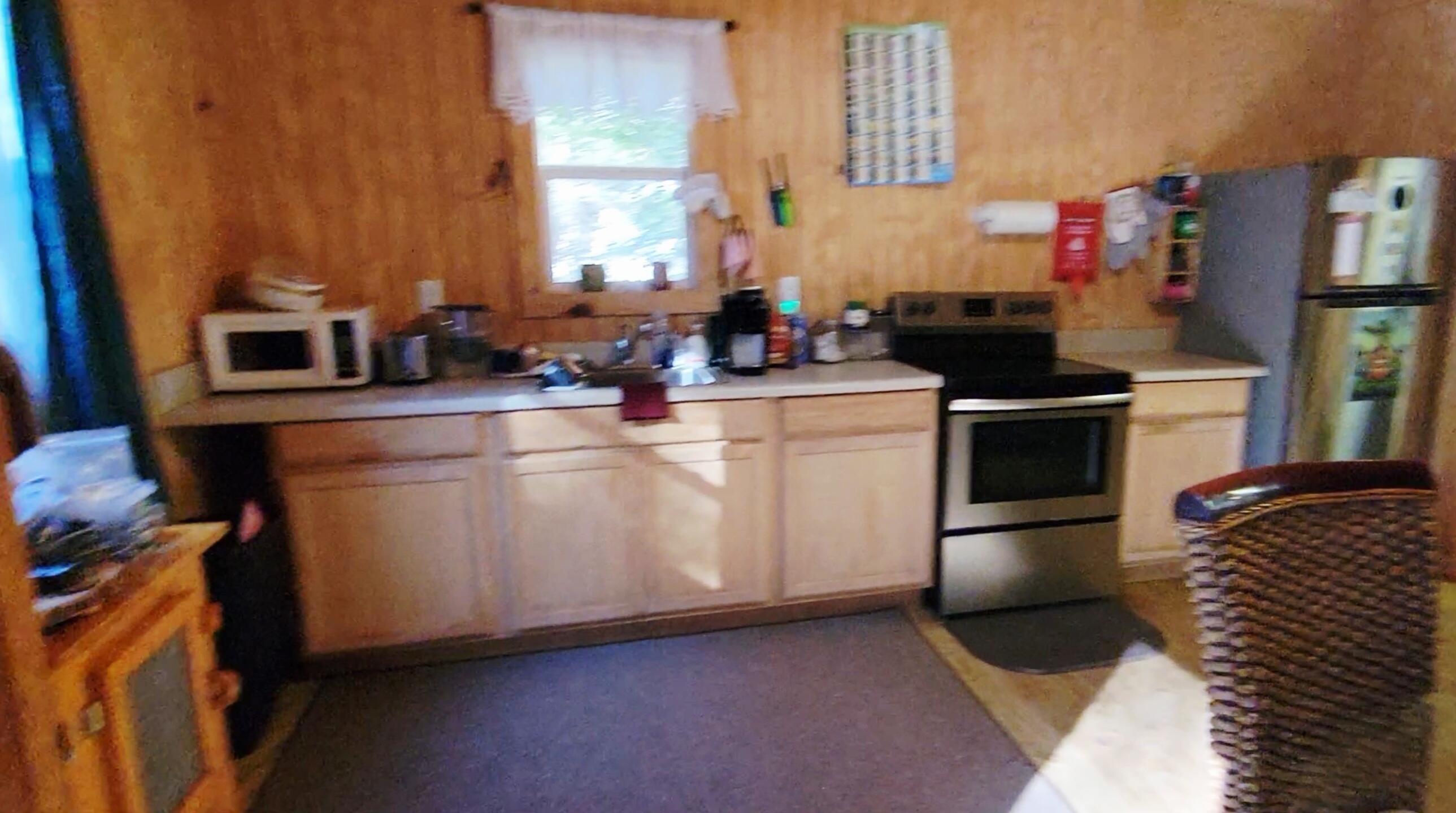 1907 River Road Ponce de Leon, FL 32455 - Photo 41 of 63 a kitchen with stainless steel appliances granite countertop a sink stove and refrigerator