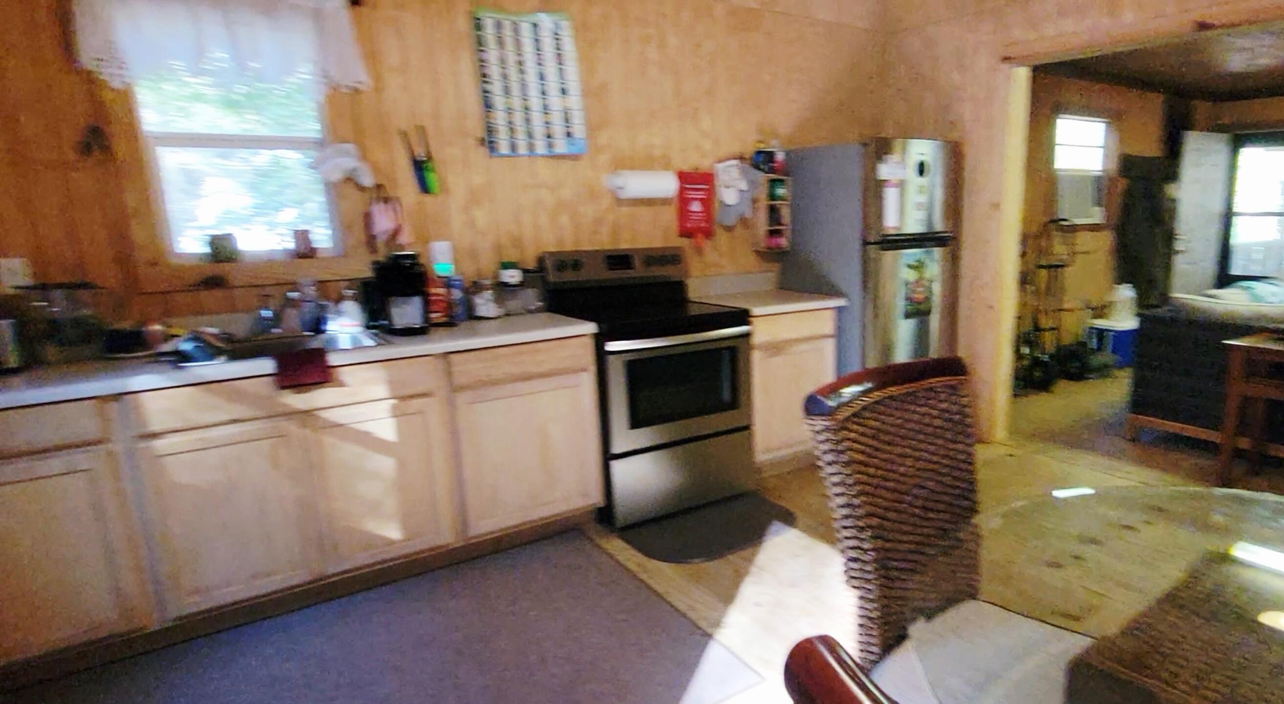 1907 River Road Ponce de Leon, FL 32455 - Photo 42 of 63 a kitchen with white cabinets and appliances