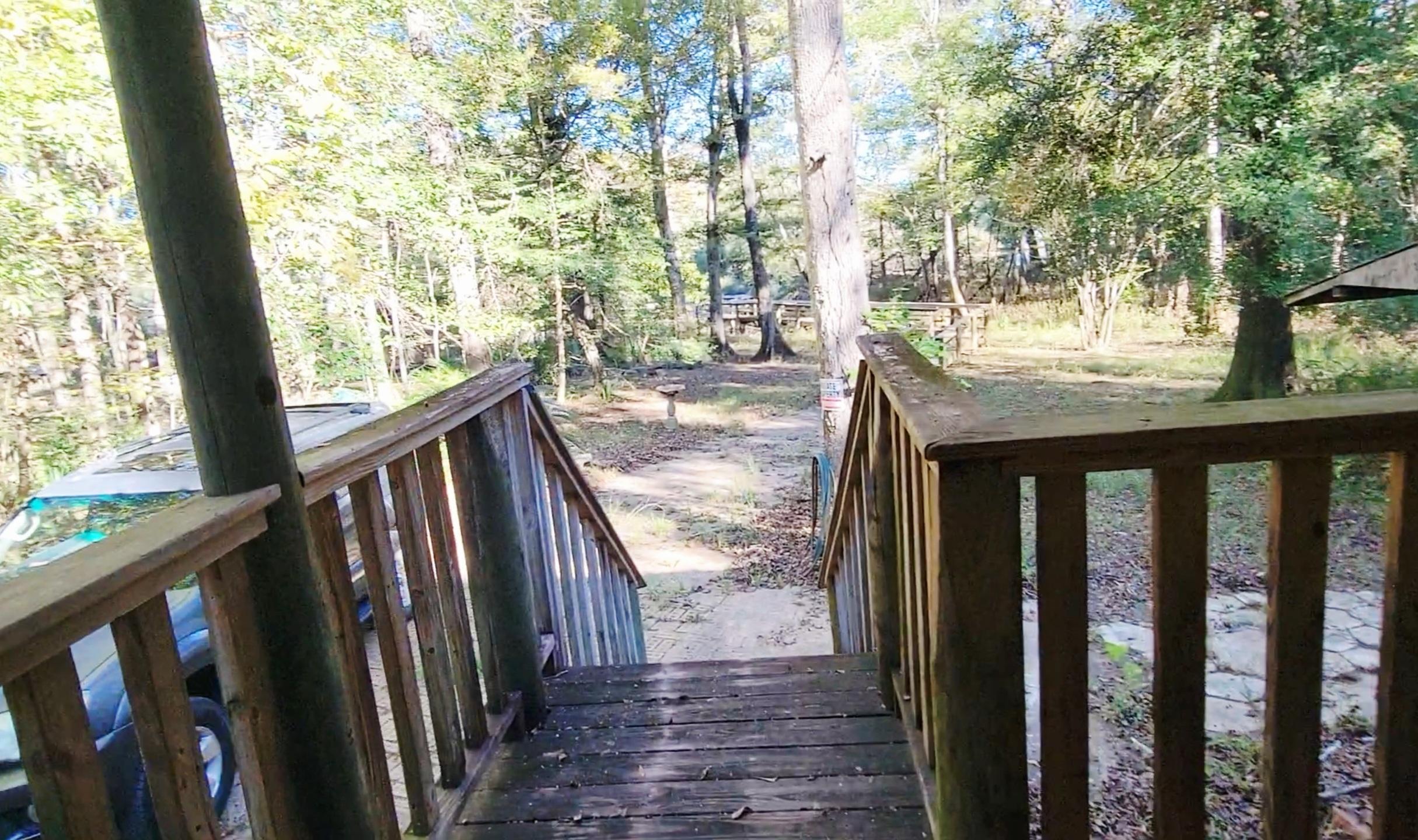 1907 River Road Ponce de Leon, FL 32455 - Photo 48 of 63 a view of balcony with wooden floor and fence