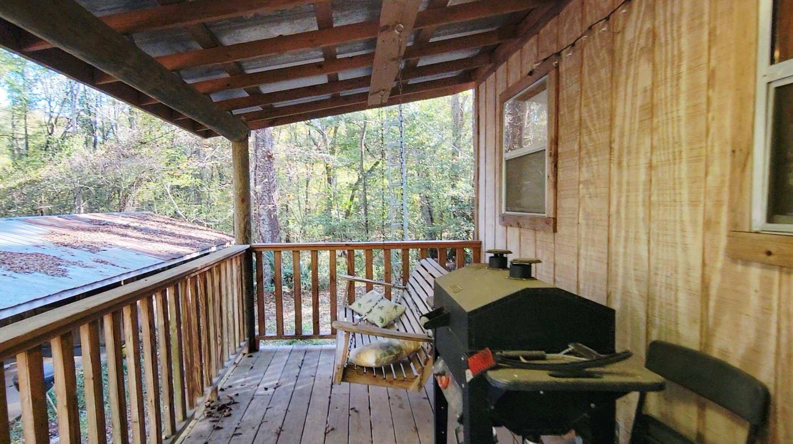 1907 River Road Ponce de Leon, FL 32455 - Photo 50 of 63 a view of balcony with wooden floor and outdoor seating
