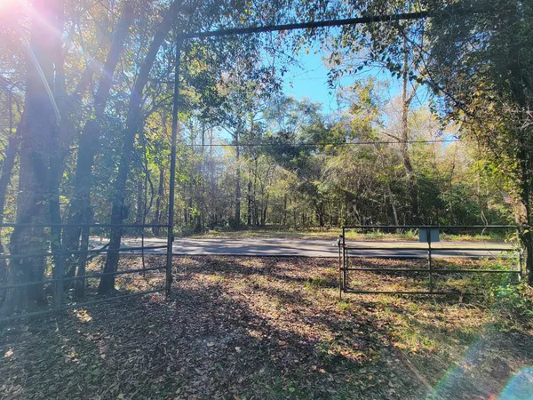 a view of outdoor space with seating area and trees around