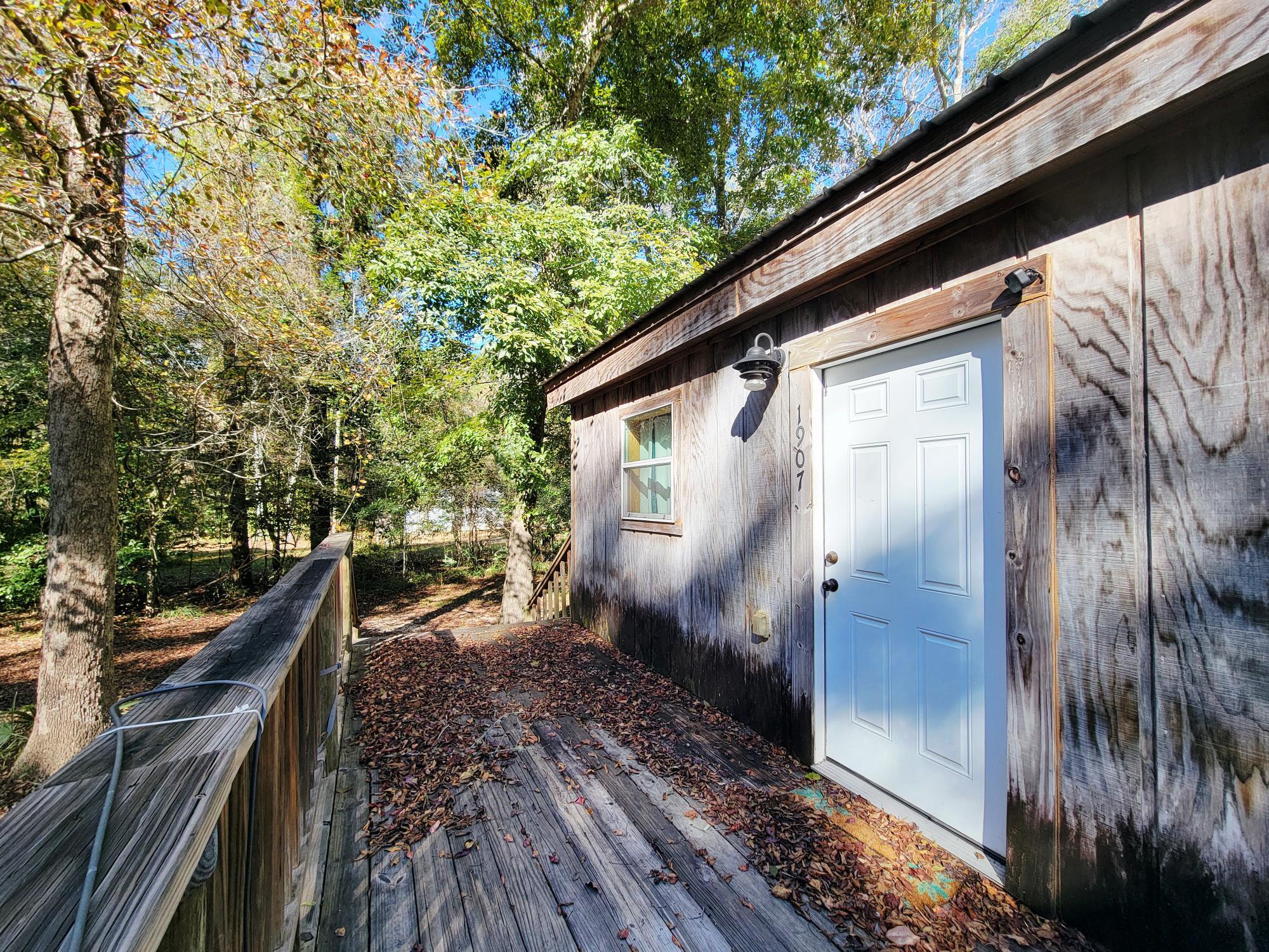 1907 River Road Ponce de Leon, FL 32455 - Photo 10 of 63 a view of deck with wooden floor and outdoor seating