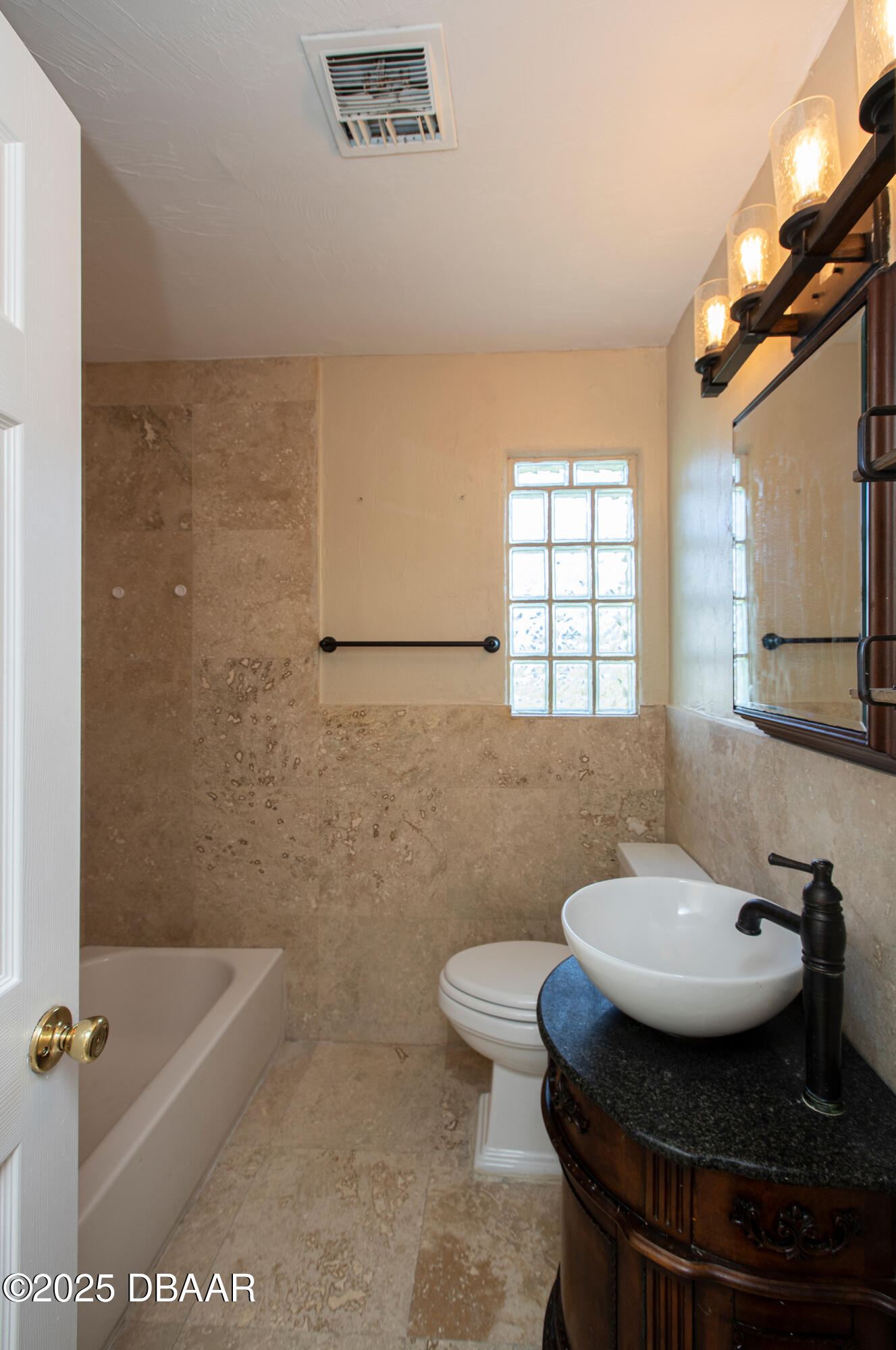 131 Minerva Road Daytona Beach, FL 32118 - Photo 9 of 21 a bathroom with a sink and a mirror